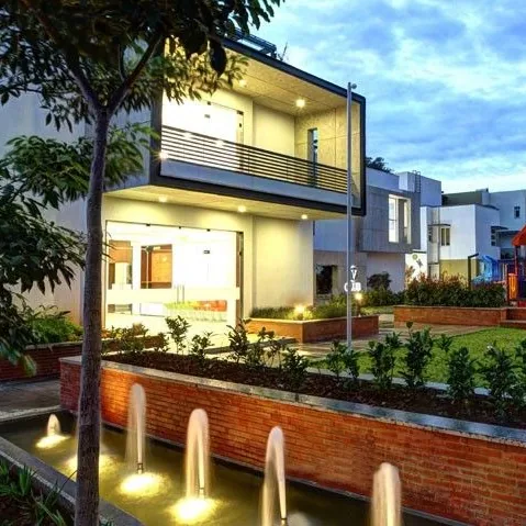 Vaishnavi Commune, Sarjapur Road A villa above a water garden at Vaishnavi Commune, at dusk
