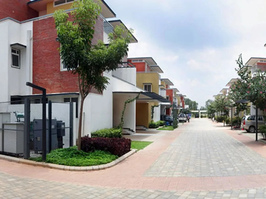 Vaishnavi Commune, Sarjapur Road A street of villas at Vaishnavi Commune, a Vaishnavi Group villa community off Sarjapur Road, shown for representation
